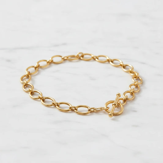 AMALFI NECKLACE | Place the original product large and centered on a clean white marble surface with a matching white marble background.