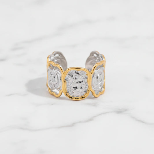 AURELIA RING | Place the original product large and centered on a clean white marble surface with a matching white marble background.
