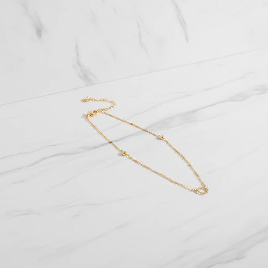 BELLAGIO BRACELET | Place the original product large and centered on a clean white marble surface with a matching white marble background.