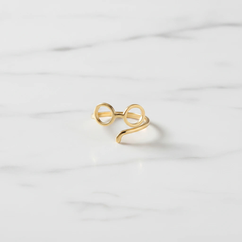 DOGS RINGS | Place the original product large and centered on a clean white marble surface with a matching white marble background.