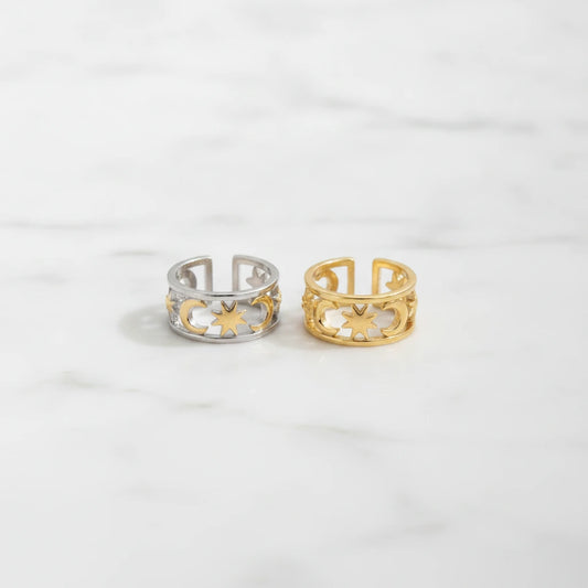 PALERMO RINGS | Place the original product large and centered on a clean white marble surface with a matching white marble background.