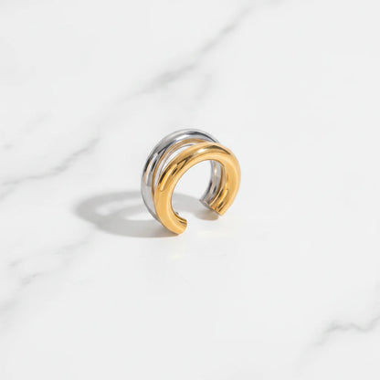 PORTO EARRINGS | Place the original product large and centered on a clean white marble surface with a matching white marble background.