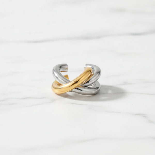 PORTO EARRINGS | Place the original product large and centered on a clean white marble surface with a matching white marble background.