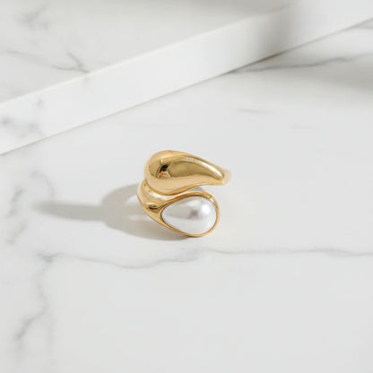SIEANA RINGS | Place the original product large and centered on a clean white marble surface with a matching white marble background.