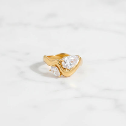 SORRENTO RINGS | Place the original product large and centered on a clean white marble surface with a matching white marble background.